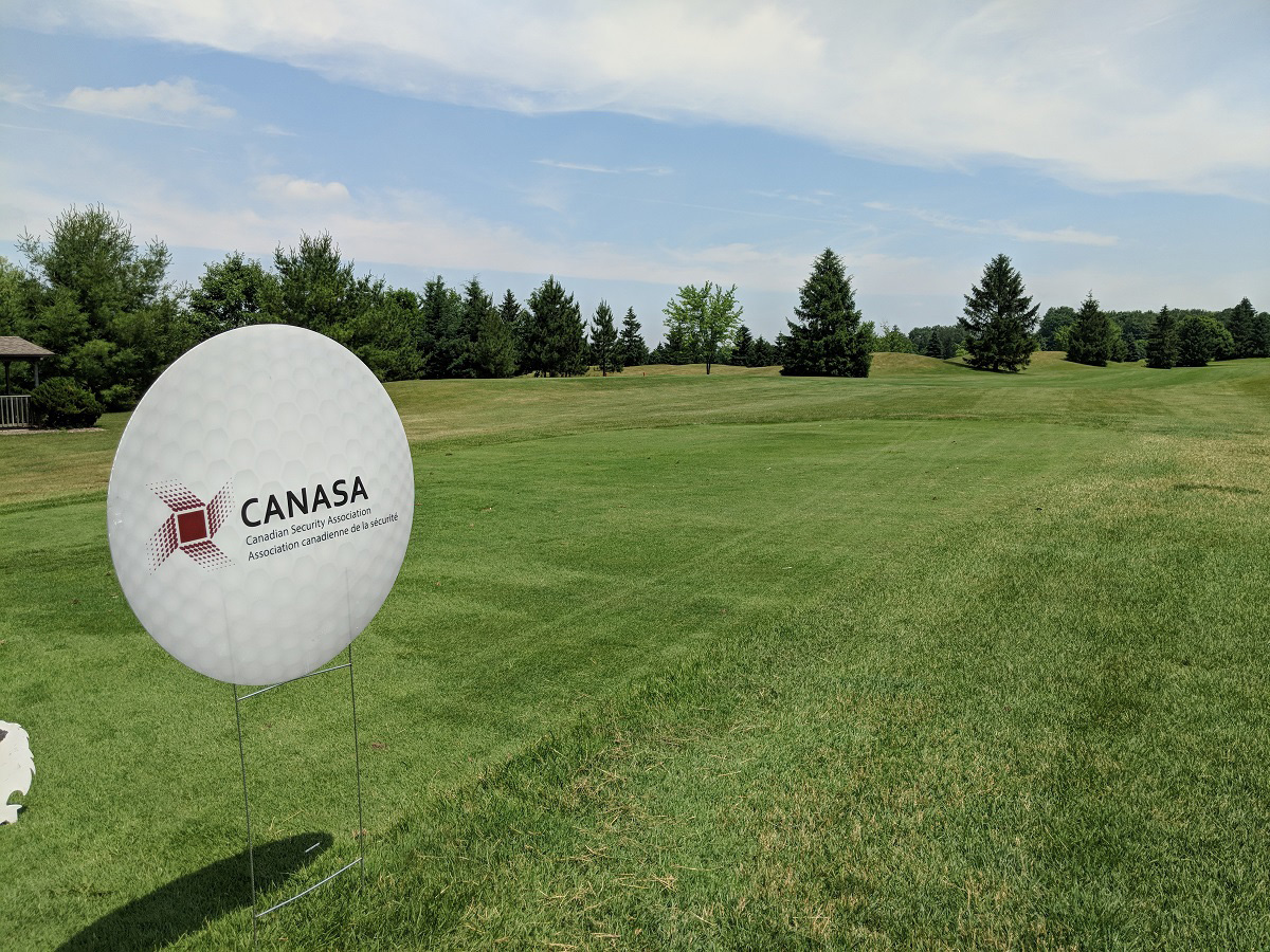 Round Outdoor Sign in Shape of Golf Ball